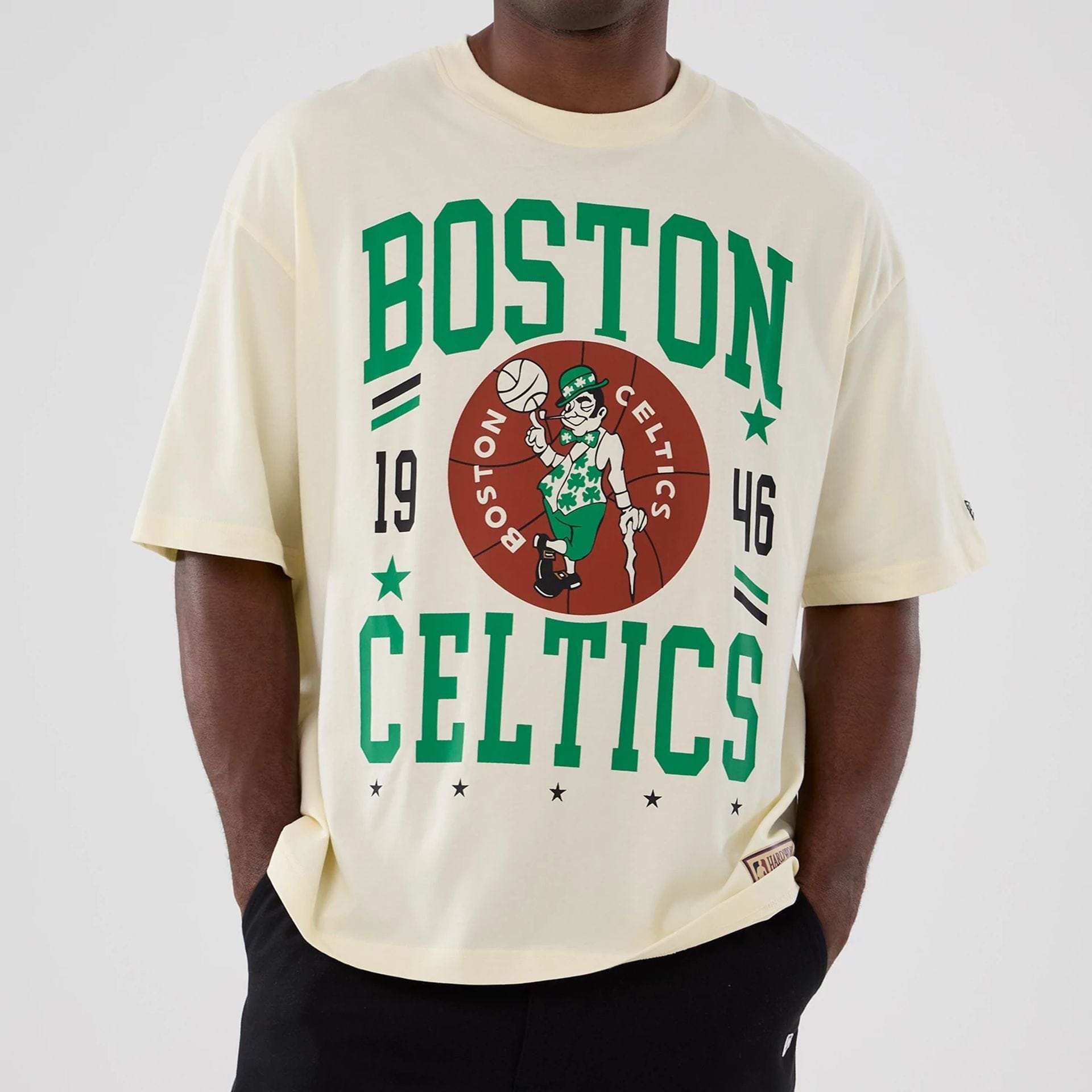 The model is wearing this NBA Hardwood Classic Boston Celtics T-Shirt in cream. 3