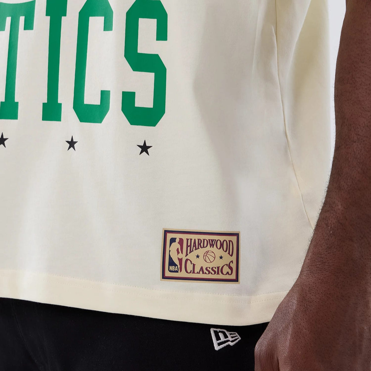 The model is wearing this NBA Hardwood Classic Boston Celtics T-Shirt in cream. 5