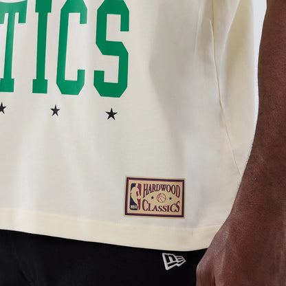 The model is wearing this NBA Hardwood Classic Boston Celtics T-Shirt in cream. 5