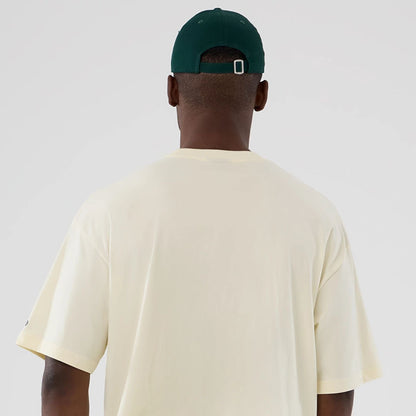 The model is wearing this NBA Hardwood Classic Boston Celtics T-Shirt in cream. 6