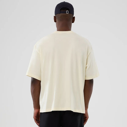 The model is wearing this NBA Hardwood Classic Detroit Pistons T-Shirt in cream. 2