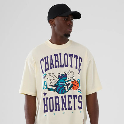 The model is wearing this NBA Hardwood Classic Charlotte Hornets T-Shirt in cream. 6