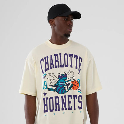 The model is wearing this NBA Hardwood Classic Charlotte Hornets T-Shirt in cream. 6