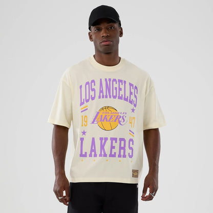 The model is wearing this NBA Hardwood Classic LA Lakers T-Shirt in cream. 1