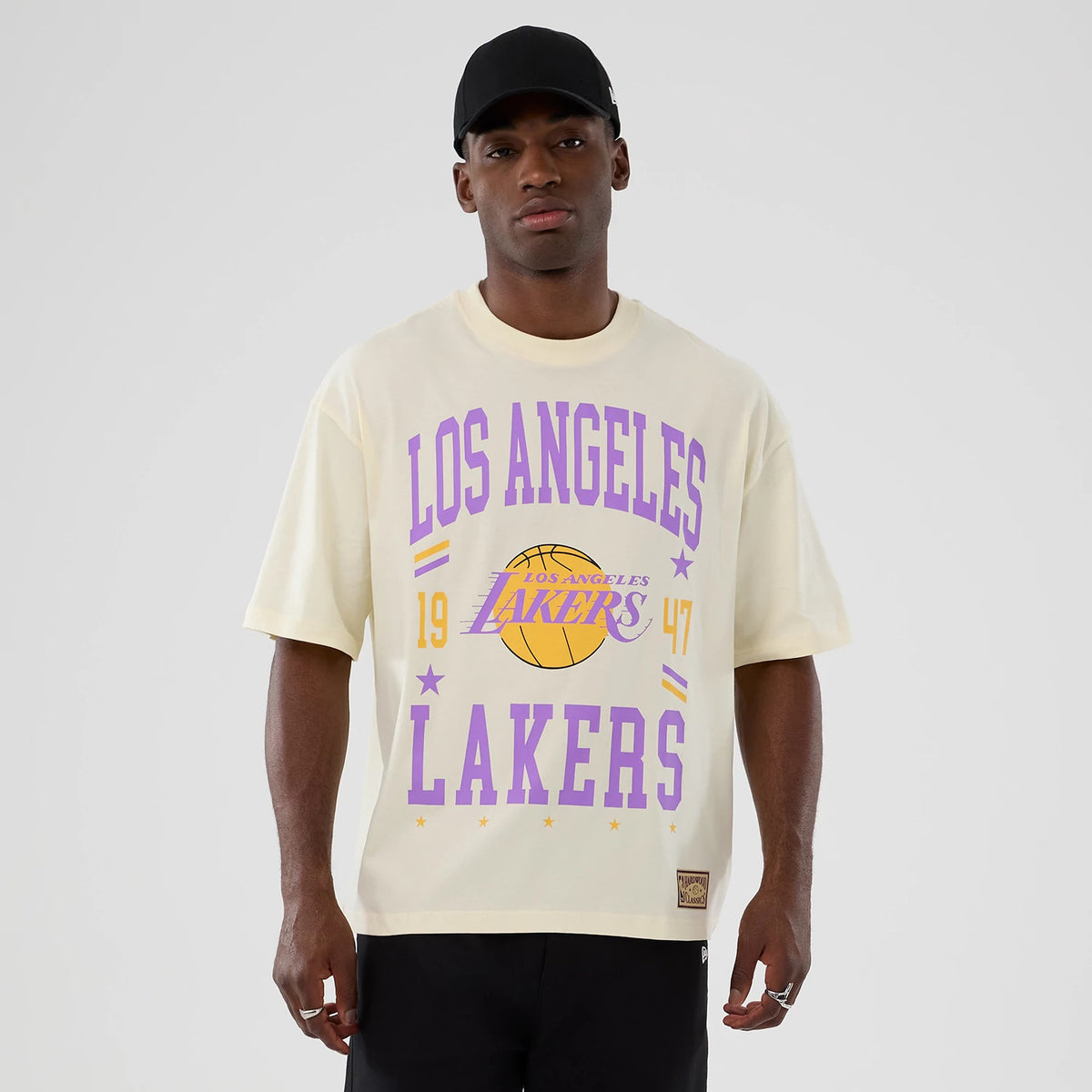 The model is wearing this NBA Hardwood Classic LA Lakers T-Shirt in cream. 1