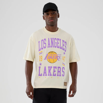 The model is wearing this NBA Hardwood Classic LA Lakers T-Shirt in cream. 1