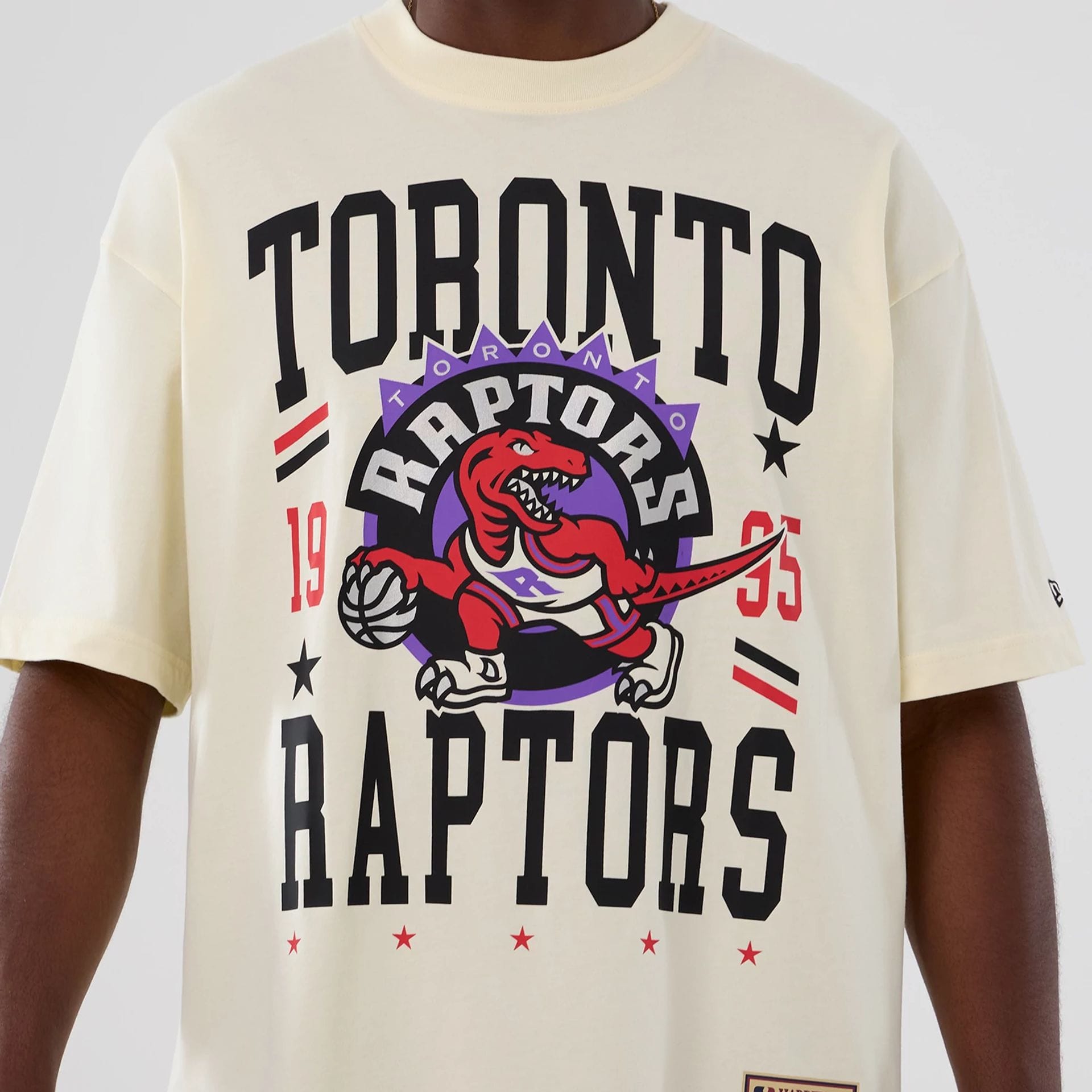The model is wearing this NBA Hardwood Classic Toronto Raptors T-Shirt in Cream . 3