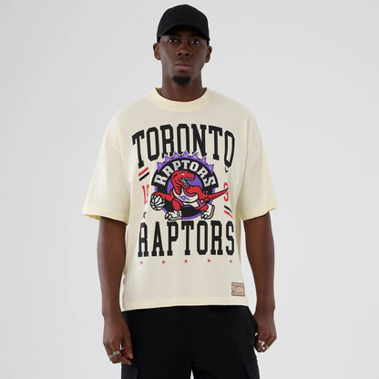 The model is wearing this NBA Hardwood Classic Toronto Raptors T-Shirt in Cream . 1