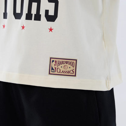 The model is wearing this NBA Hardwood Classic Toronto Raptors T-Shirt in Cream . 5