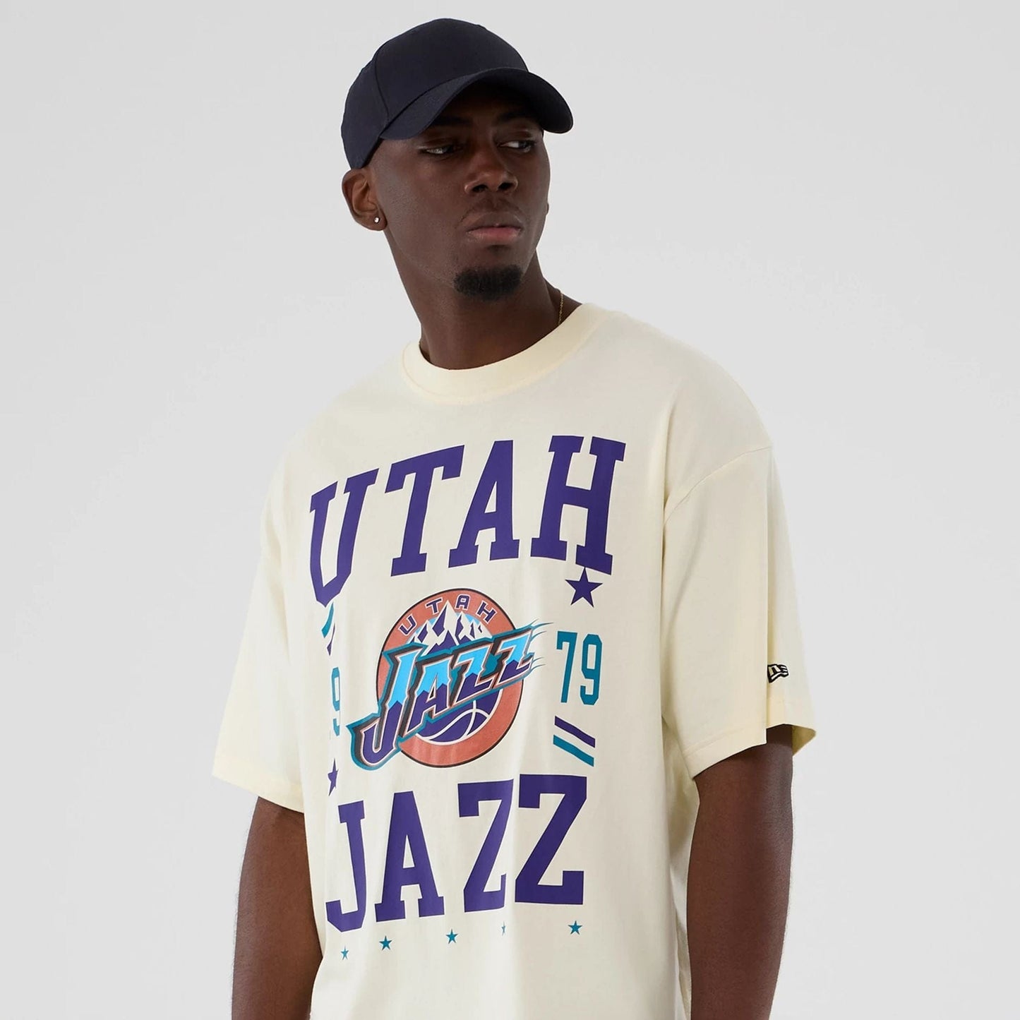 The model is wearing this NBA Hardwood Classic Utah Jazz T-Shirt in Cream. 6