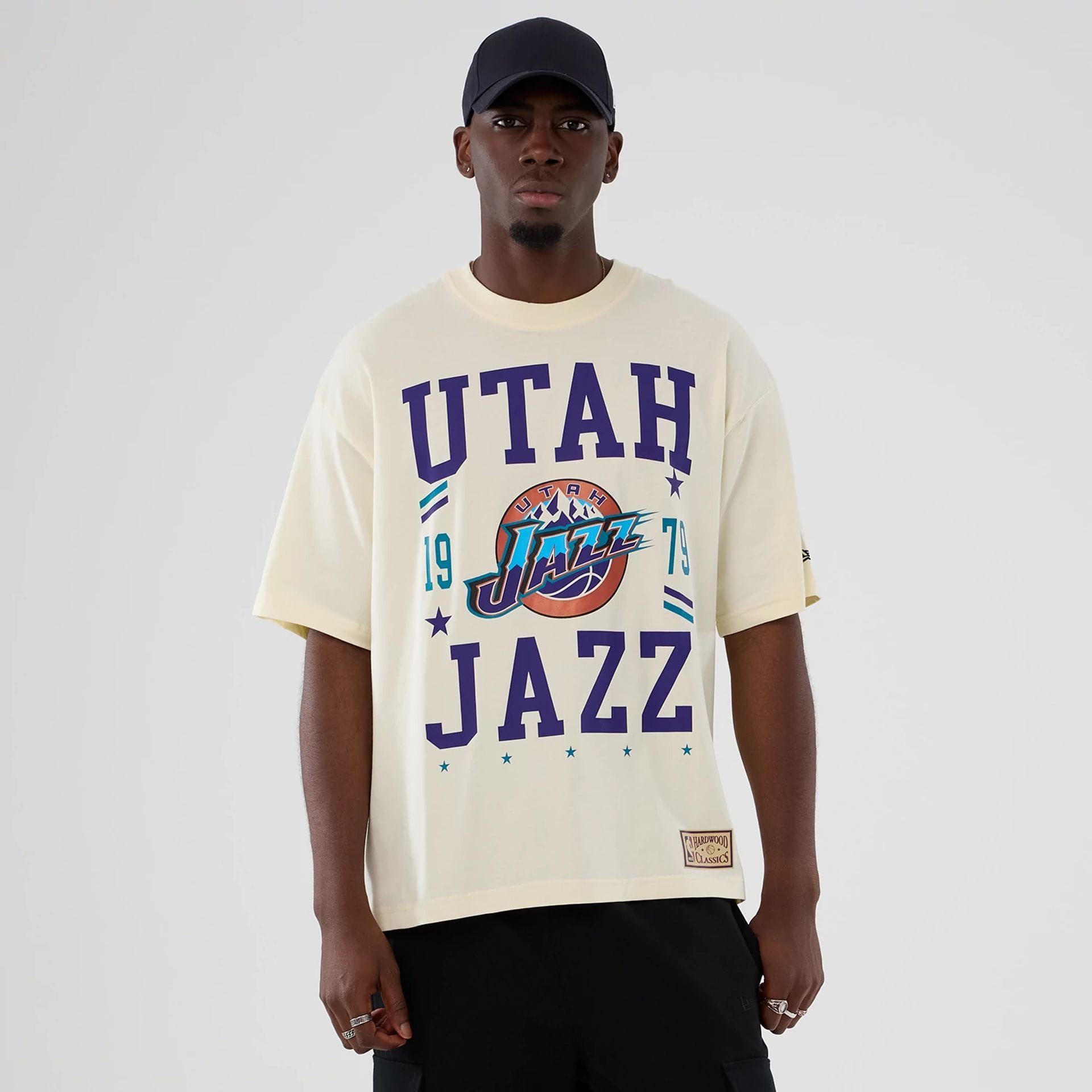 The model is wearing this NBA Hardwood Classic Utah Jazz T-Shirt in Cream. 1