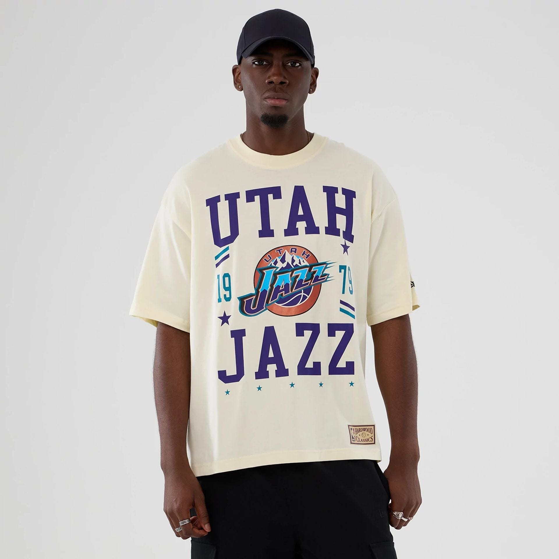 The model is wearing this NBA Hardwood Classic Utah Jazz T-Shirt in Cream. 1