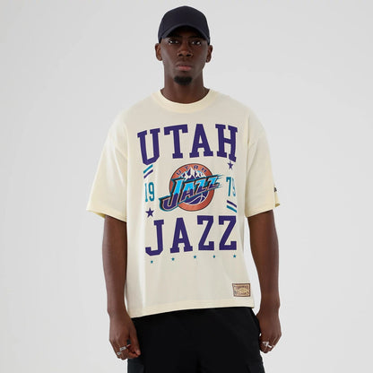 The model is wearing this NBA Hardwood Classic Utah Jazz T-Shirt in Cream. 1