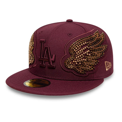 Pictured is this MLB Beaded Wings LA Dodgers 59FIFTY Fitted cap in dark red. 1