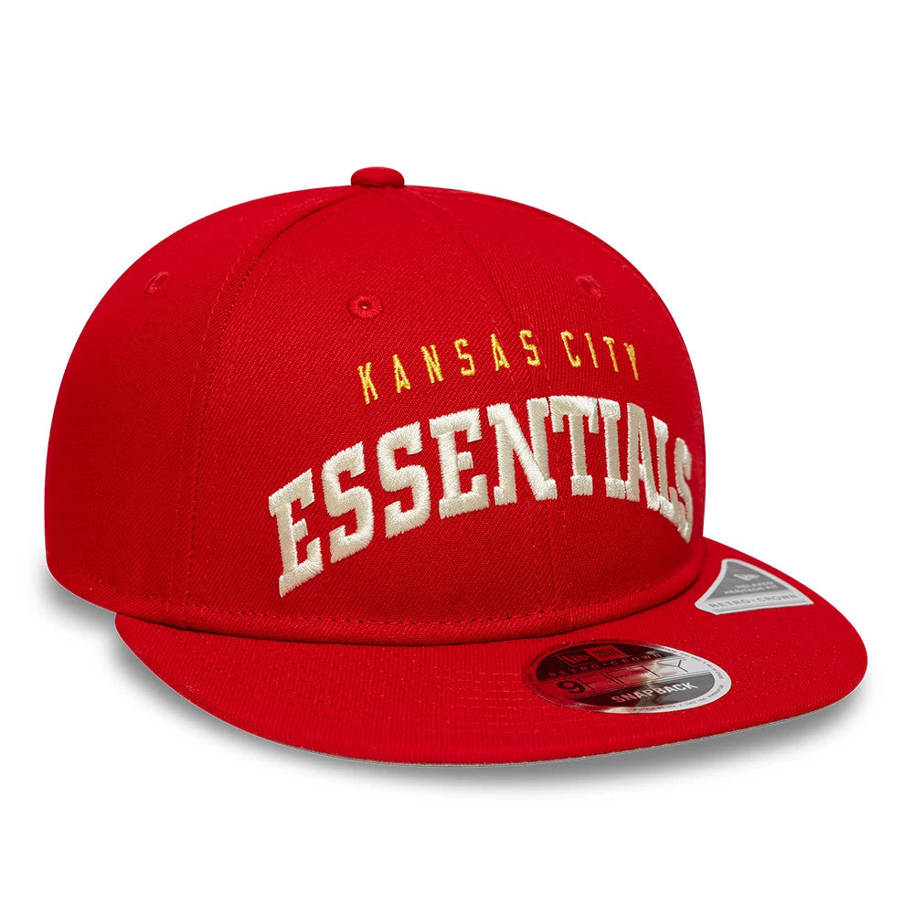 Kansas City Chiefs Fear Of God x NFL Red Retro Crown New Era 9FIFTY Adjustable Cap, three-quarter view showing large white raised ESSENTIALS embroidery on the front, with KANSAS CITY in smaller gold lettering above.