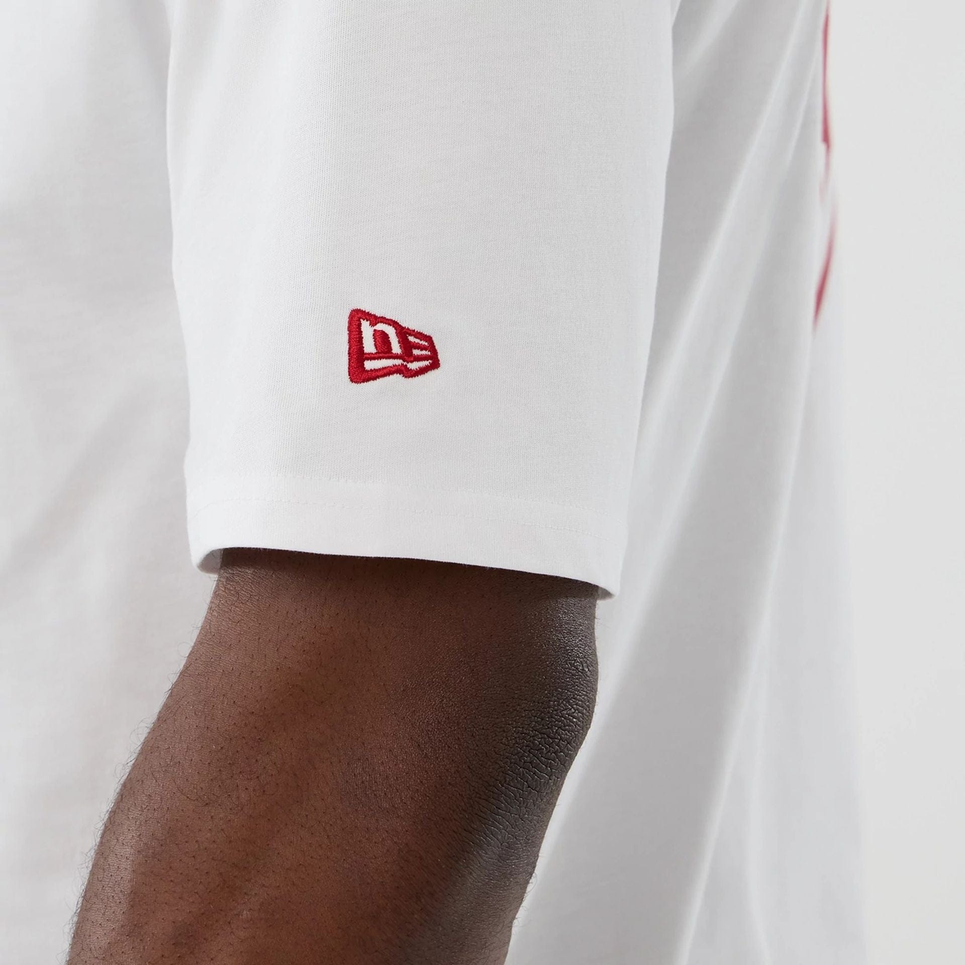 The Male model is wearing Atlanta Falcons NFL International Series Games 2025 White Oversized T-Shirt  6