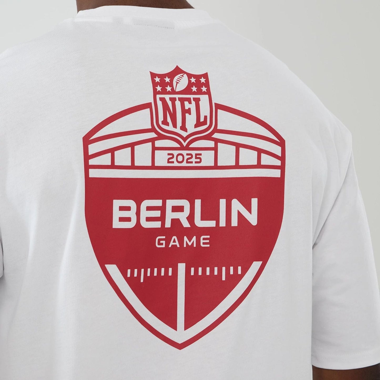 The Male model is wearing Atlanta Falcons NFL International Series Games 2025 White Oversized T-Shirt  5