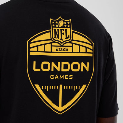 The Male model is wearing Minnesota Vikings NFL International Series Games 2025 Black Oversized T-Shirt  4