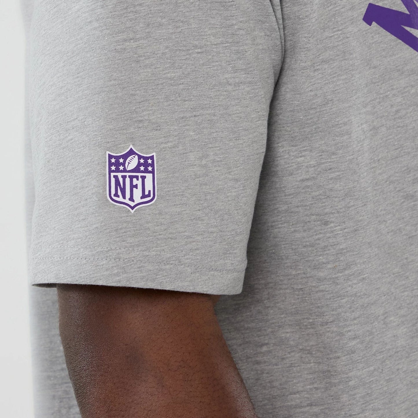 The Male model is wearing Minnesota Vikings NFL International Series Games 2025 Grey Oversized T-Shirt  5
