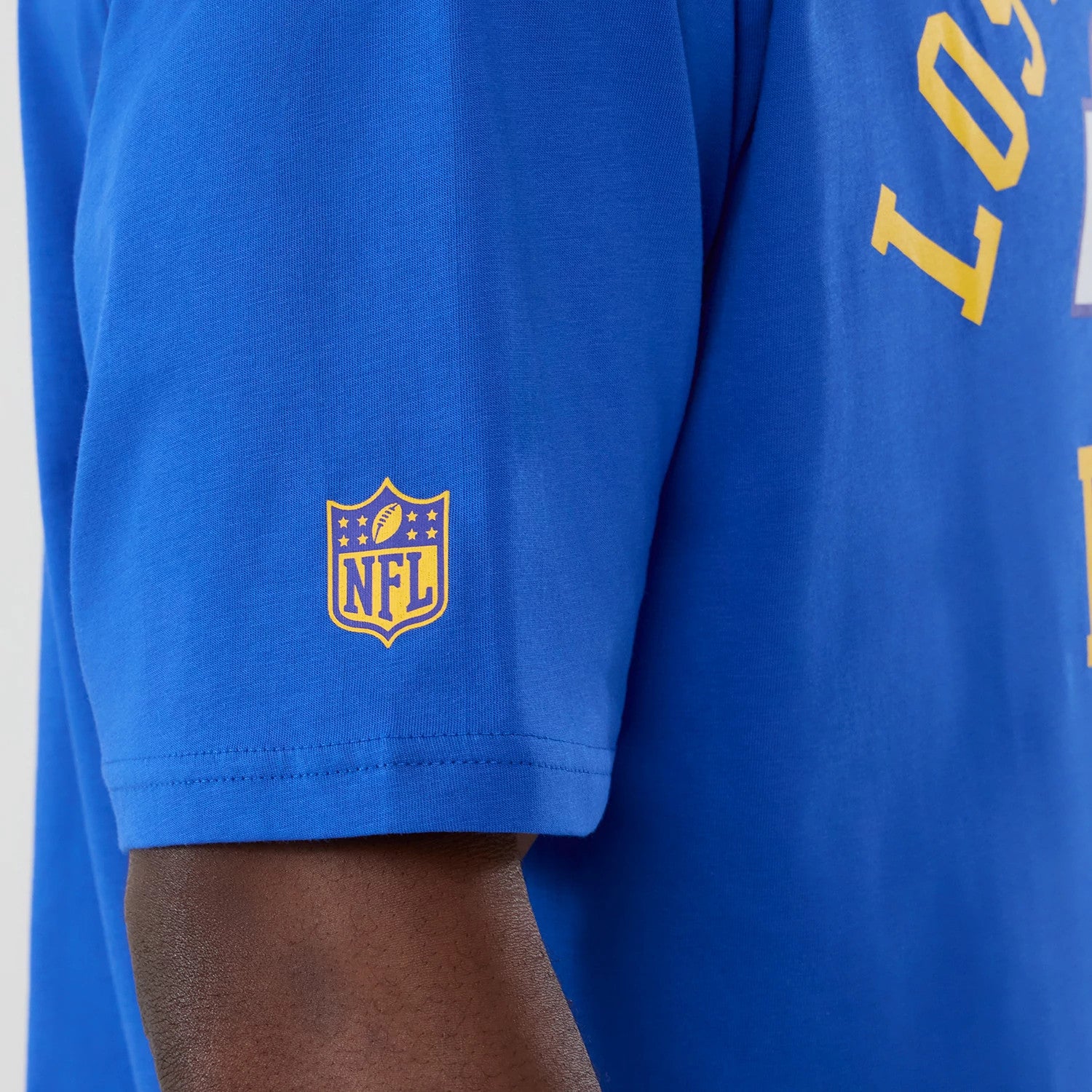 The Male model is wearing LA Rams NFL International Series Games 2025 Bright Blue Oversized T-Shirt 5