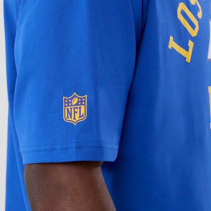 The Male model is wearing LA Rams NFL International Series Games 2025 Bright Blue Oversized T-Shirt 5