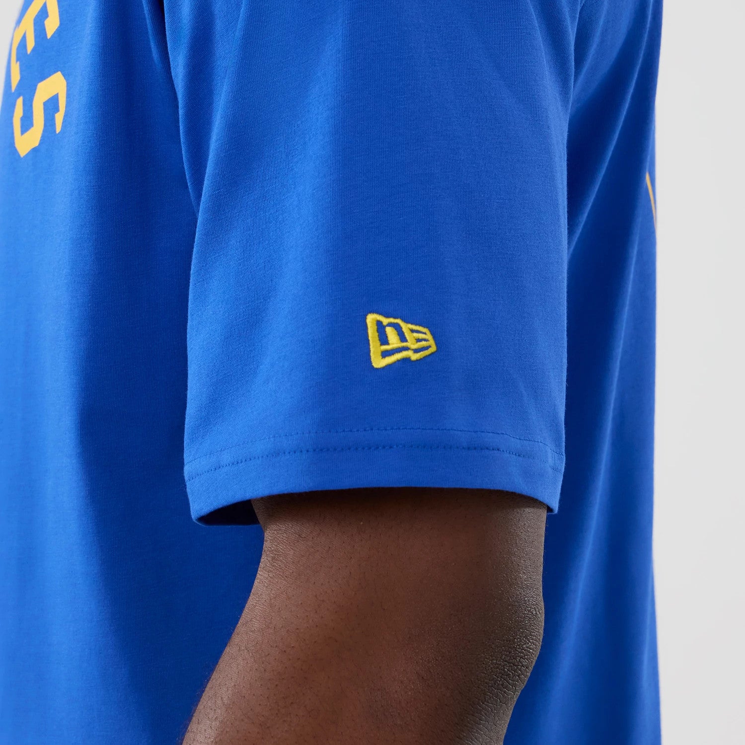 The Male model is wearing LA Rams NFL International Series Games 2025 Bright Blue Oversized T-Shirt 6