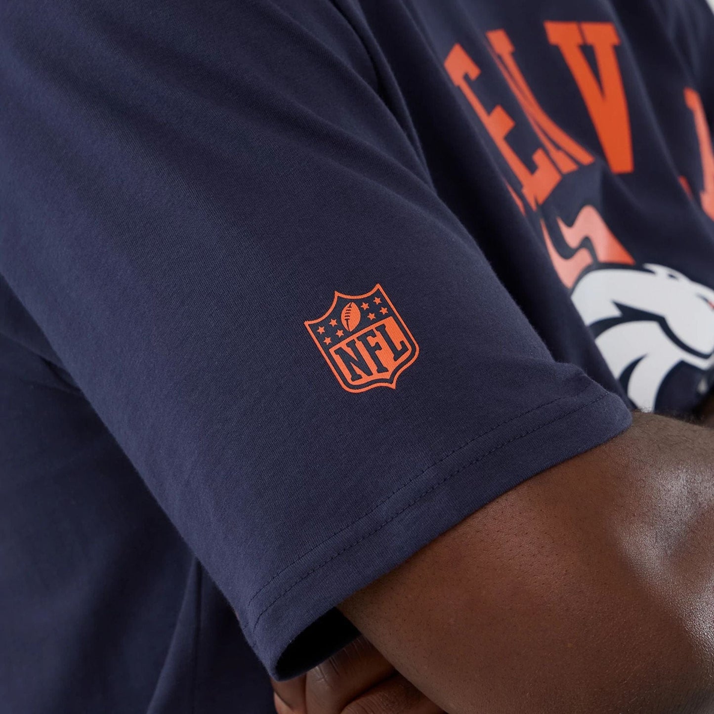 The Male model is wearing Denver Broncos NFL International Series Games 2025 Navy Oversized T-Shirt  5