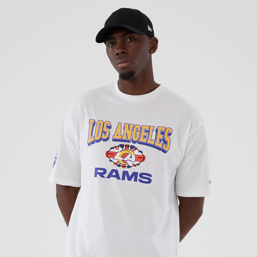 The Male model is wearing LA Rams NFL International Series Games 2025 White Oversized T-Shirt  3