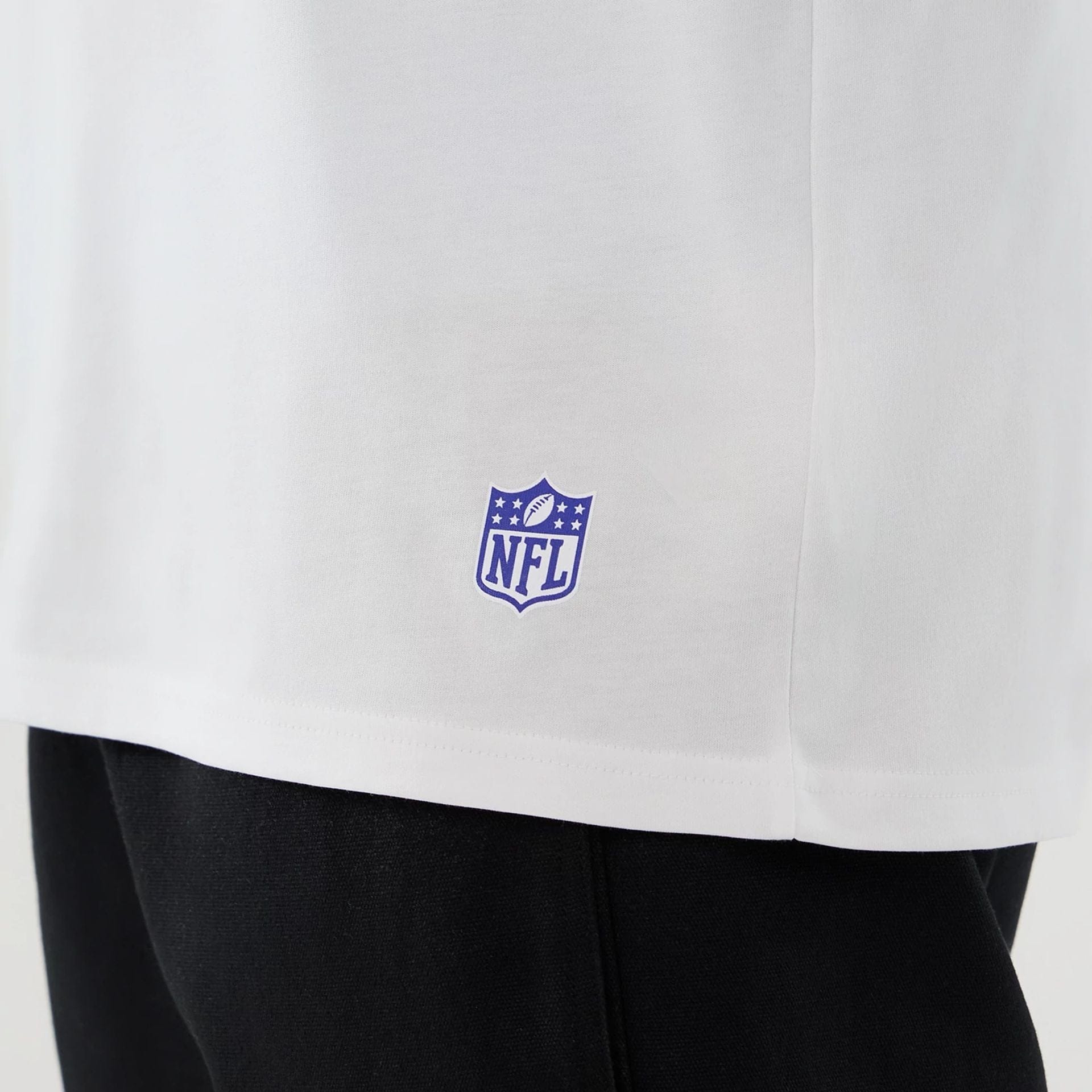 The Male model is wearing LA Rams NFL International Series Games 2025 White Oversized T-Shirt  5