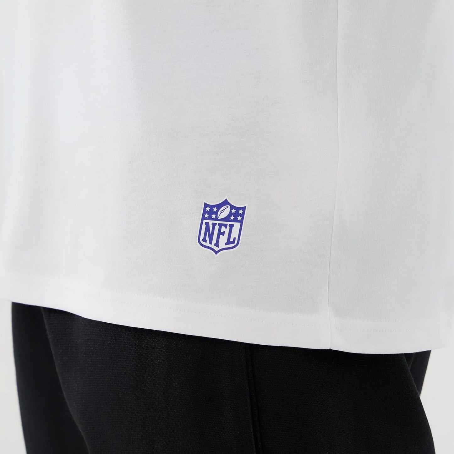 The Male model is wearing LA Rams NFL International Series Games 2025 White Oversized T-Shirt 5