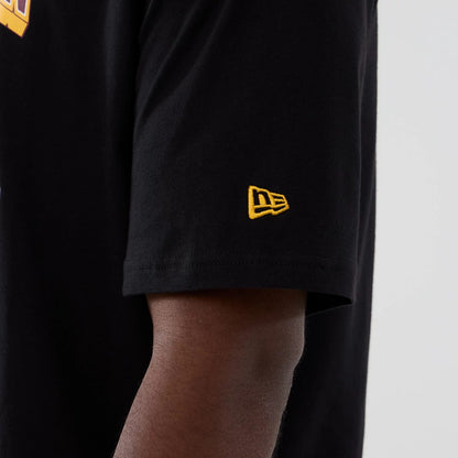 The Male model is wearing Washington Commanders Script NFL International Series Games 2025 Black Oversized T-Shirt 4