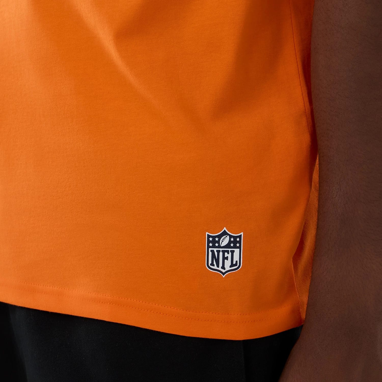 The Male model is wearing Denver Broncos NFL International Series Games 2025 Orange Oversized T-Shirt 5