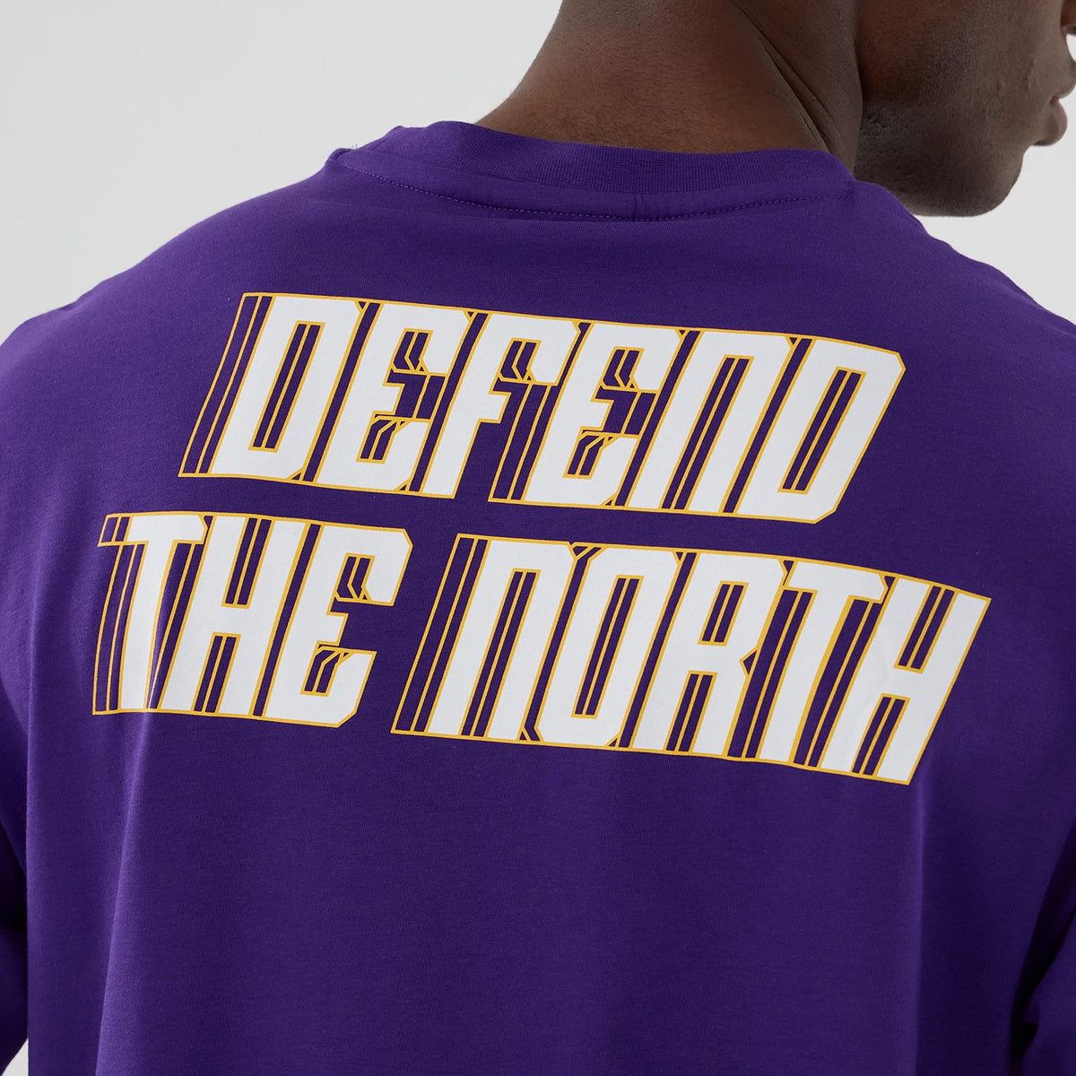 The Male model is wearing Minnesota Vikings NFL International Series Games 2025 Purple Oversized T-Shirt 6