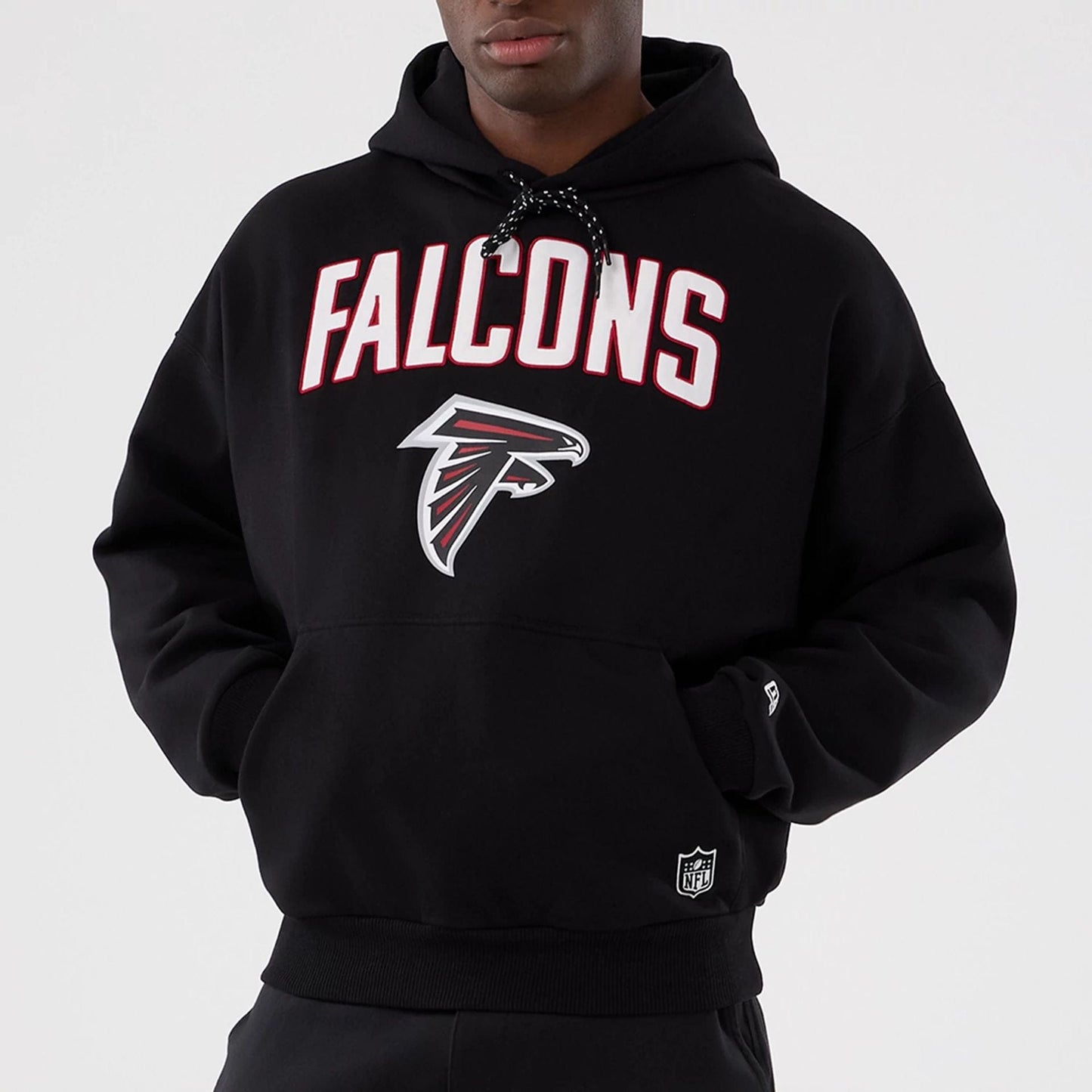 The Male model is wearing Atlanta Falcons NFL International Series Games 2025 Black Premium Pullover Hoodie  7