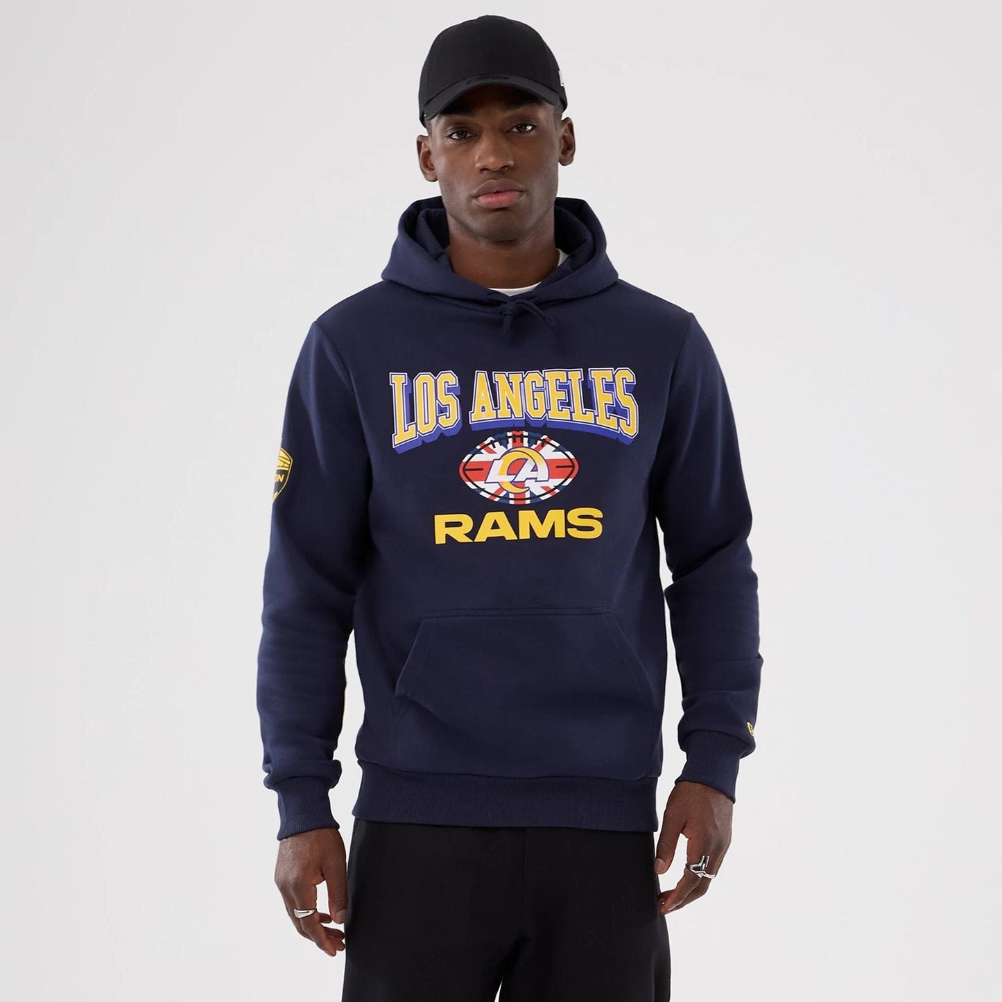 The Male model is wearing LA Rams NFL International Series Games 2025 Navy Pullover Hoodie  1