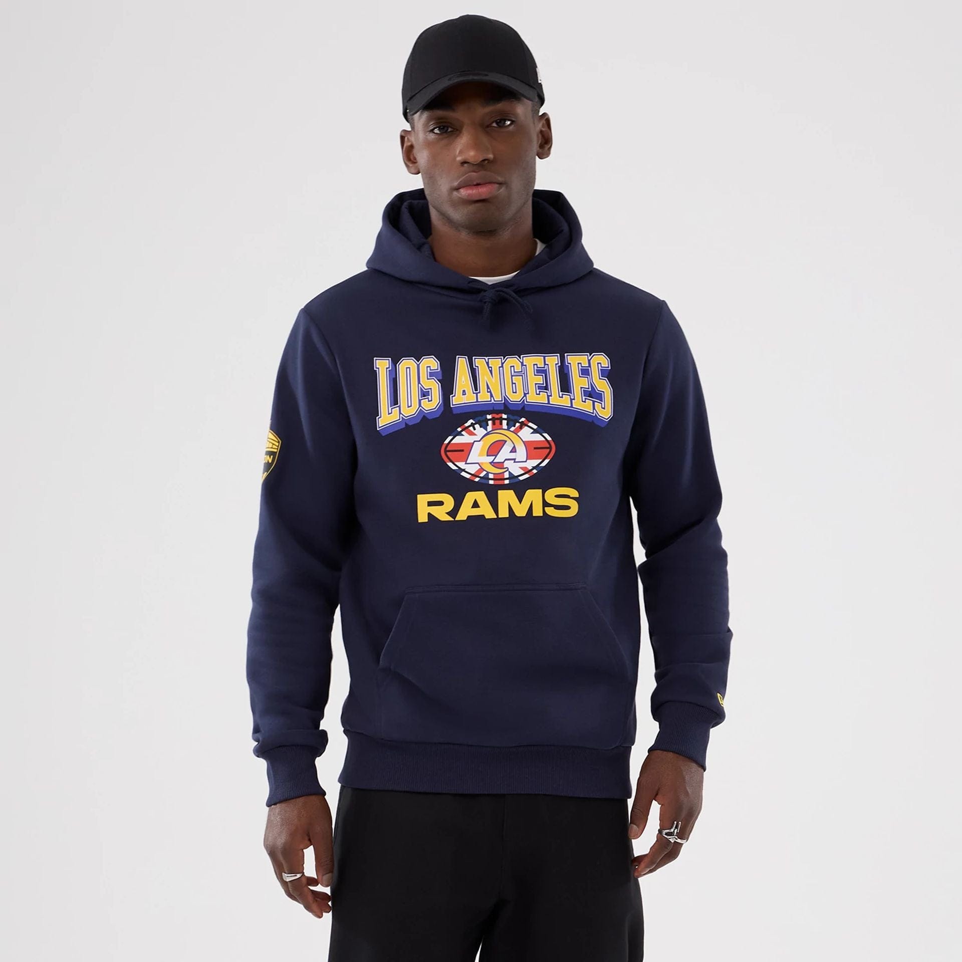 The Male model is wearing LA Rams NFL International Series Games 2025 Navy Pullover Hoodie  1