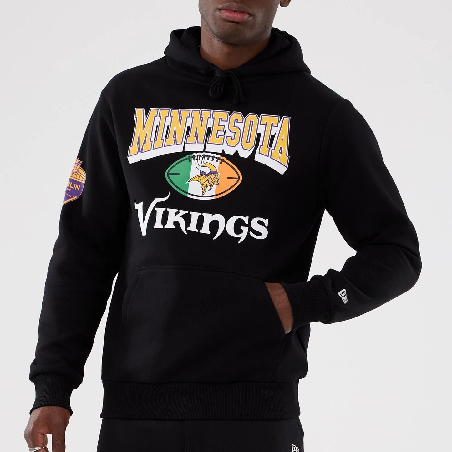The Male model is wearing Minnesota Vikings NFL International Series Games 2025 Black Pullover Hoodie  7