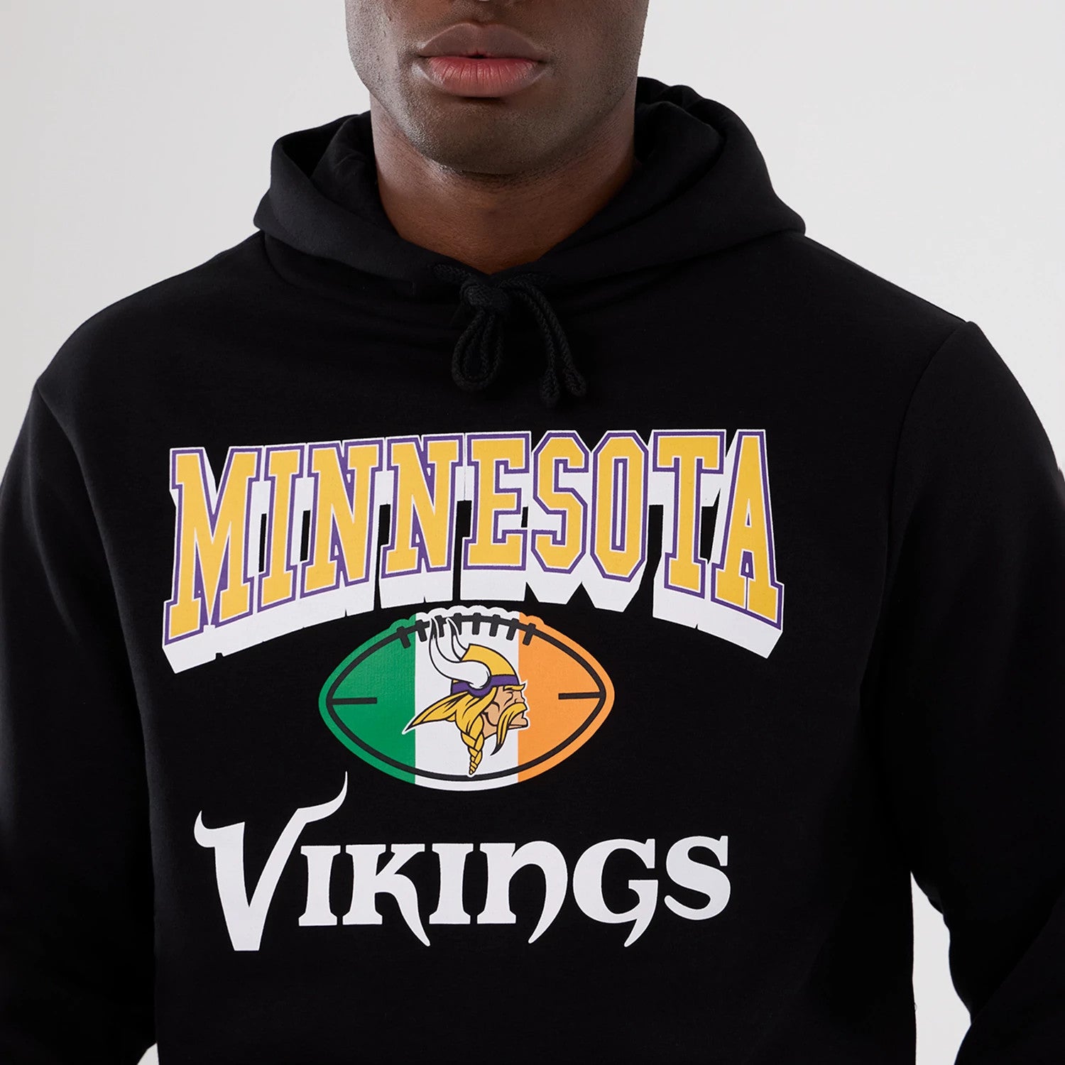 The Male model is wearing Minnesota Vikings NFL International Series Games 2025 Black Pullover Hoodie 3