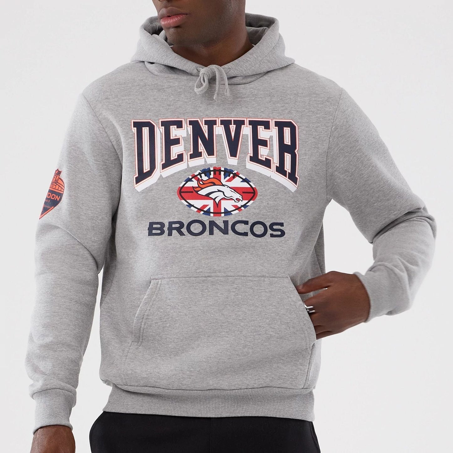 The Male model is wearing Denver Broncos NFL International Series Games 2025 Grey Pullover Hoodie  7
