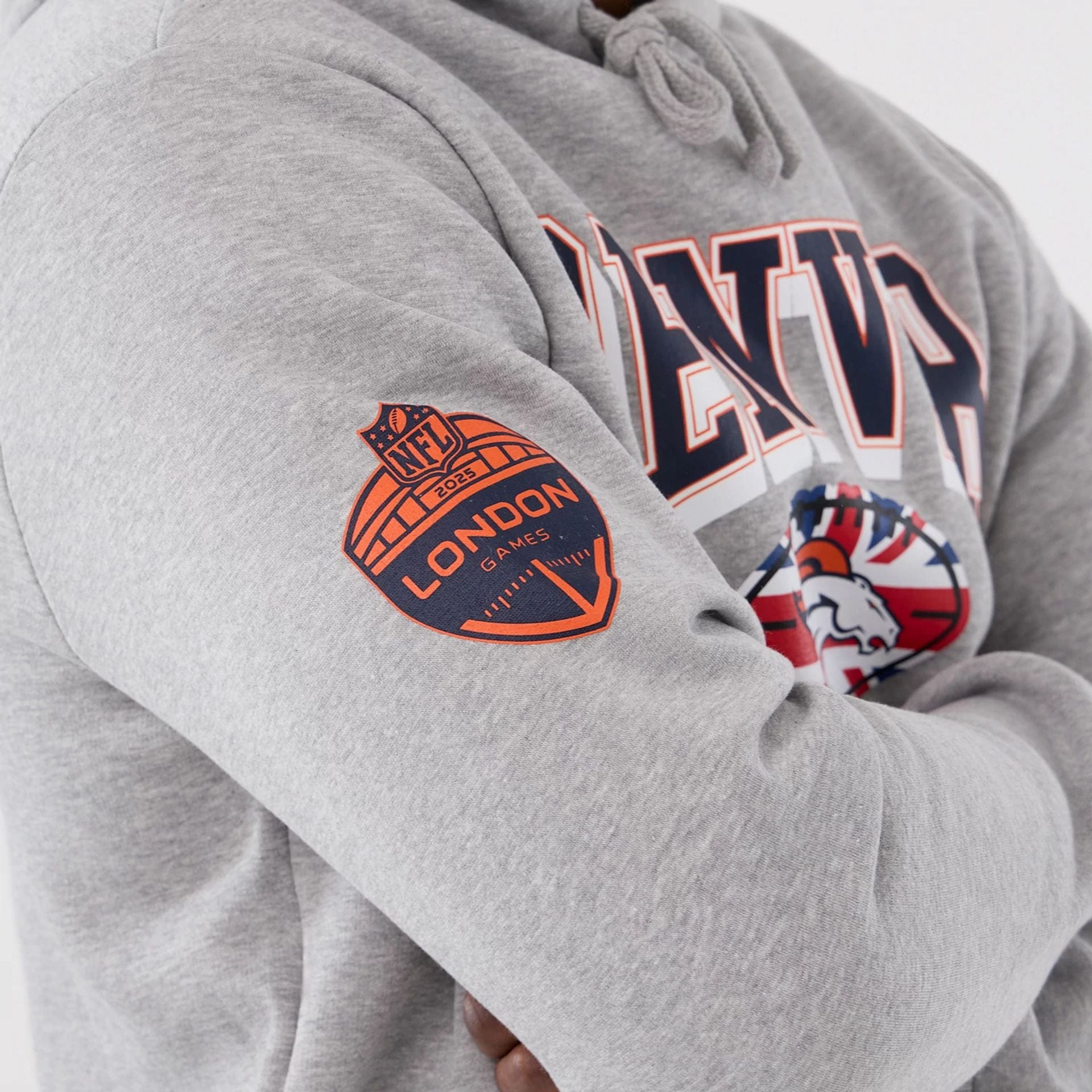 The Male model is wearing Denver Broncos NFL International Series Games 2025 Grey Pullover Hoodie  4