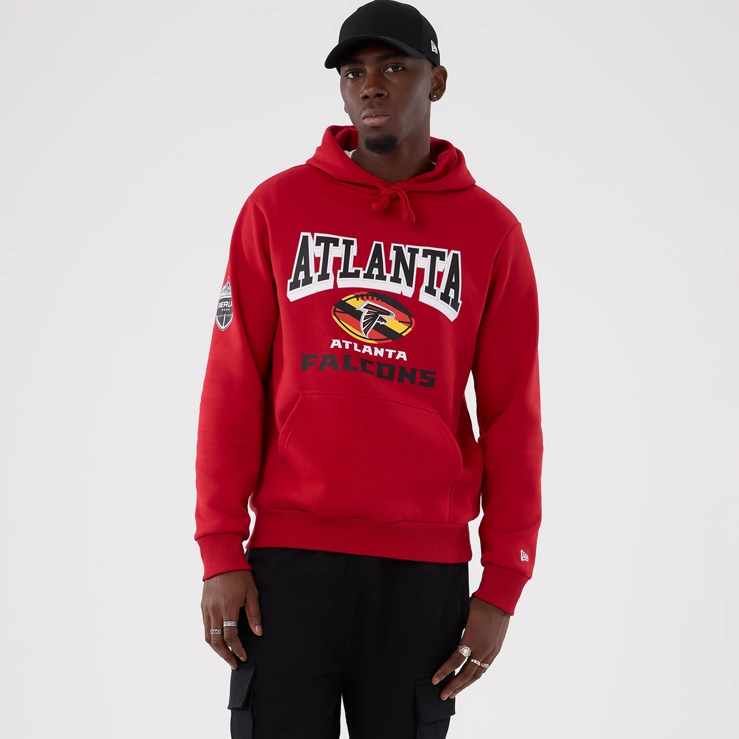 The Male model is wearing Atlanta Falcons NFL International Series Games 2025 Red Pullover Hoodie 1