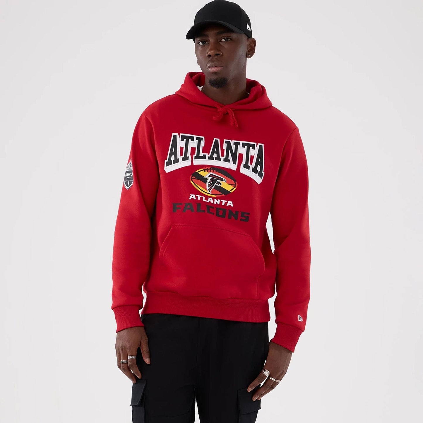 The Male model is wearing Atlanta Falcons NFL International Series Games 2025 Red Pullover Hoodie  1