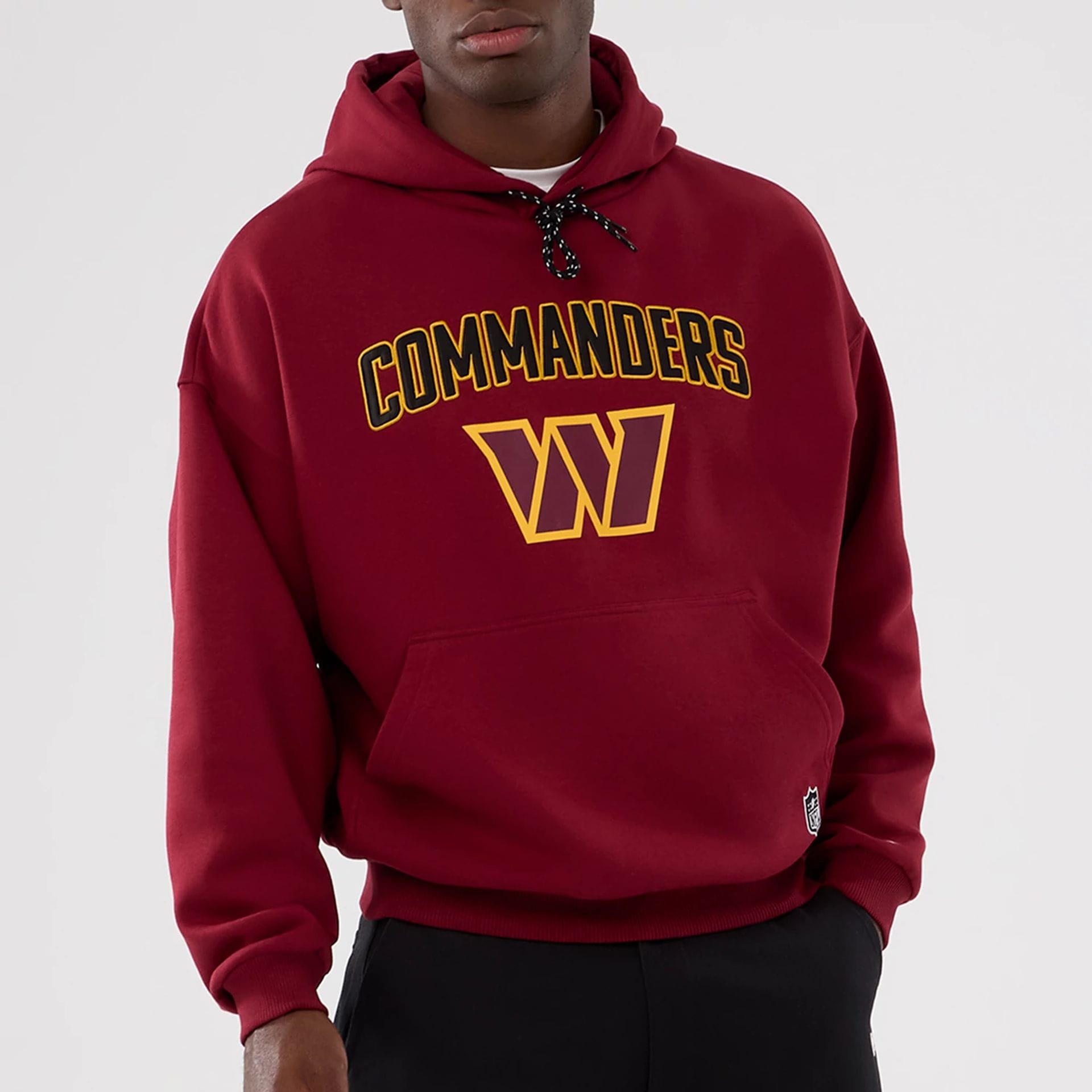 The Male model is wearing Washington Commanders NFL International Series Games 2025 Dark Red Premium Pullover Hoodie 7