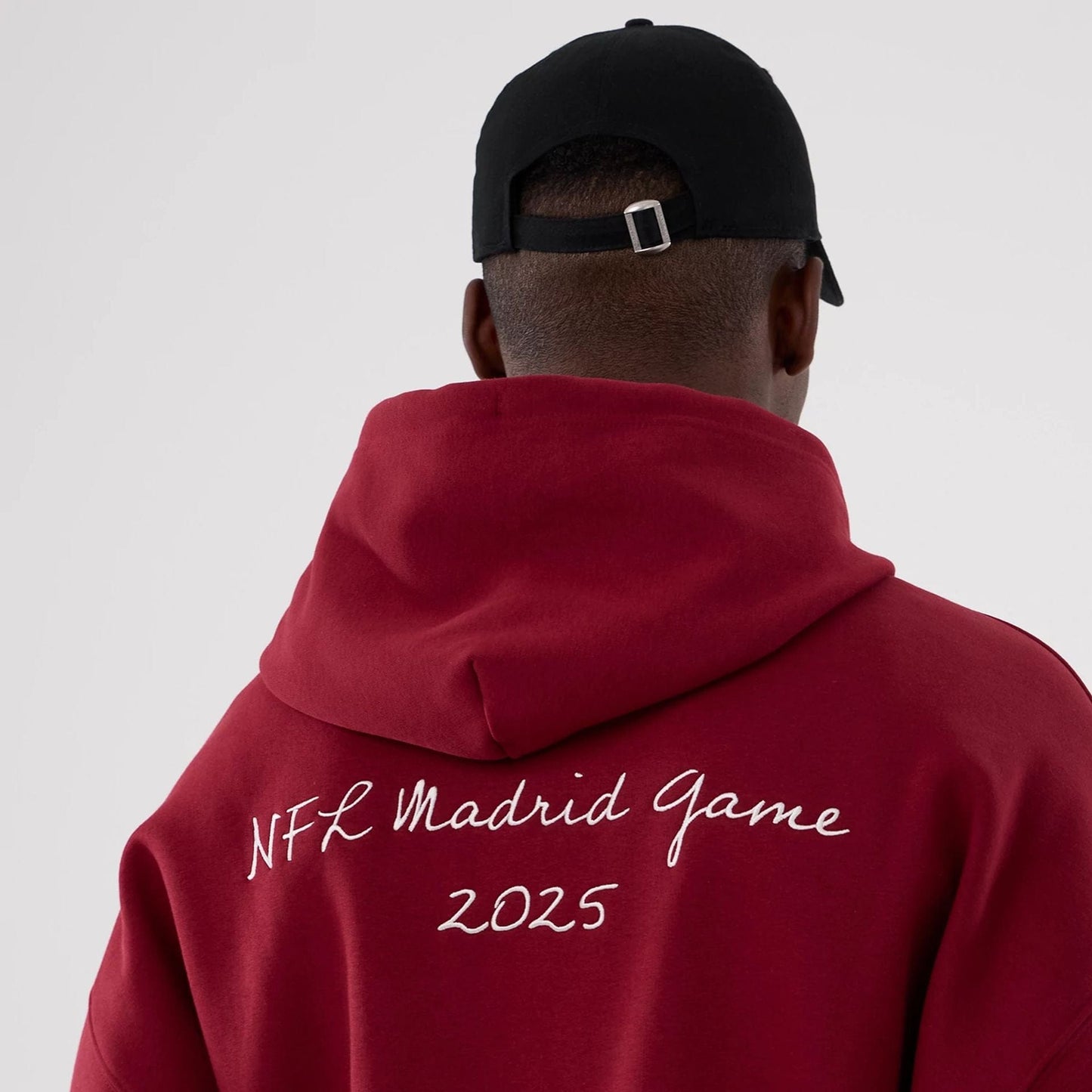The Male model is wearing Washington Commanders NFL International Series Games 2025 Dark Red Premium Pullover Hoodie  6