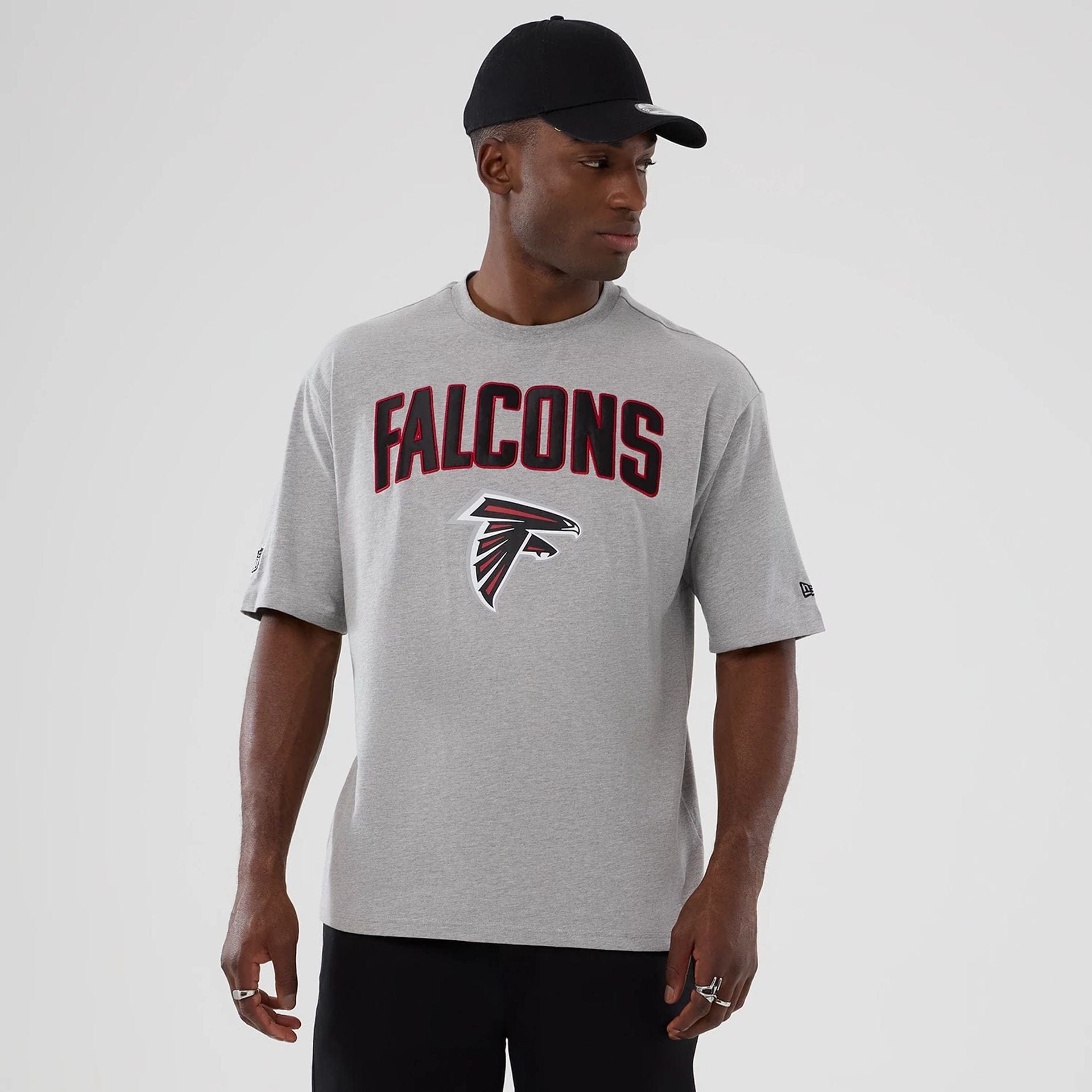 The Male model is wearing Atlanta Falcons NFL International Series Games 2025 Grey Premium T-Shirt 1