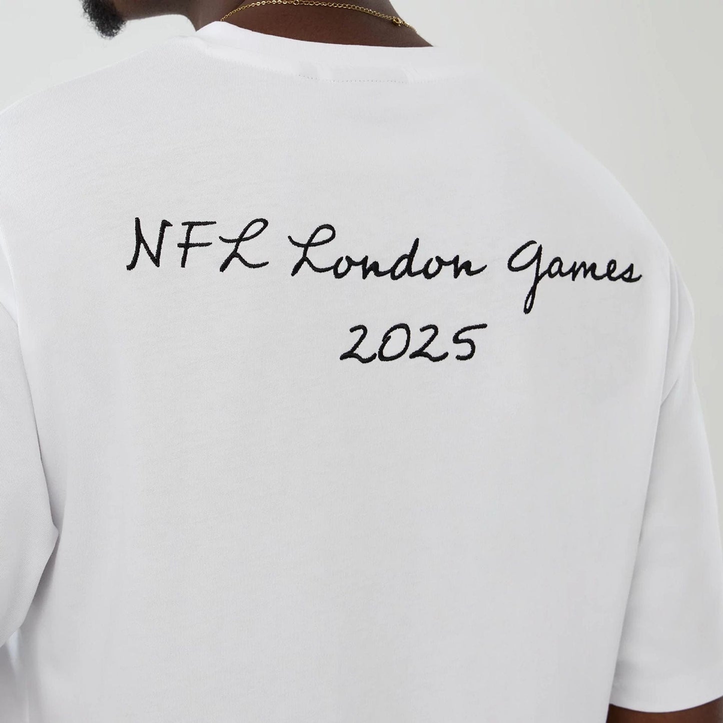 The Male model is wearing LA Rams NFL International Series Games 2025 White Premium T-Shirt  6