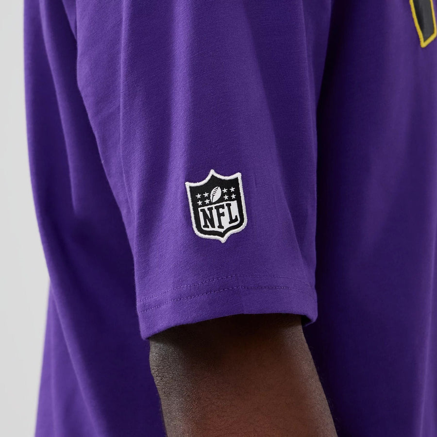 The Male model is wearing Minnesota Vikings NFL International Series Games 2025 Purple Premium T-Shirt  6