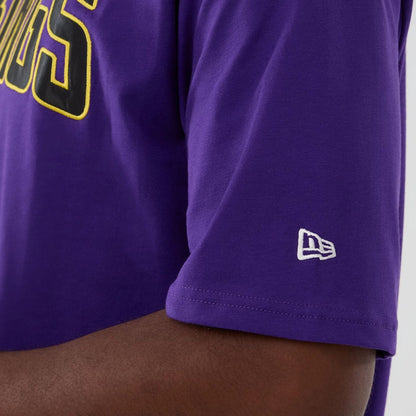 The Male model is wearing Minnesota Vikings NFL International Series Games 2025 Purple Premium T-Shirt  4