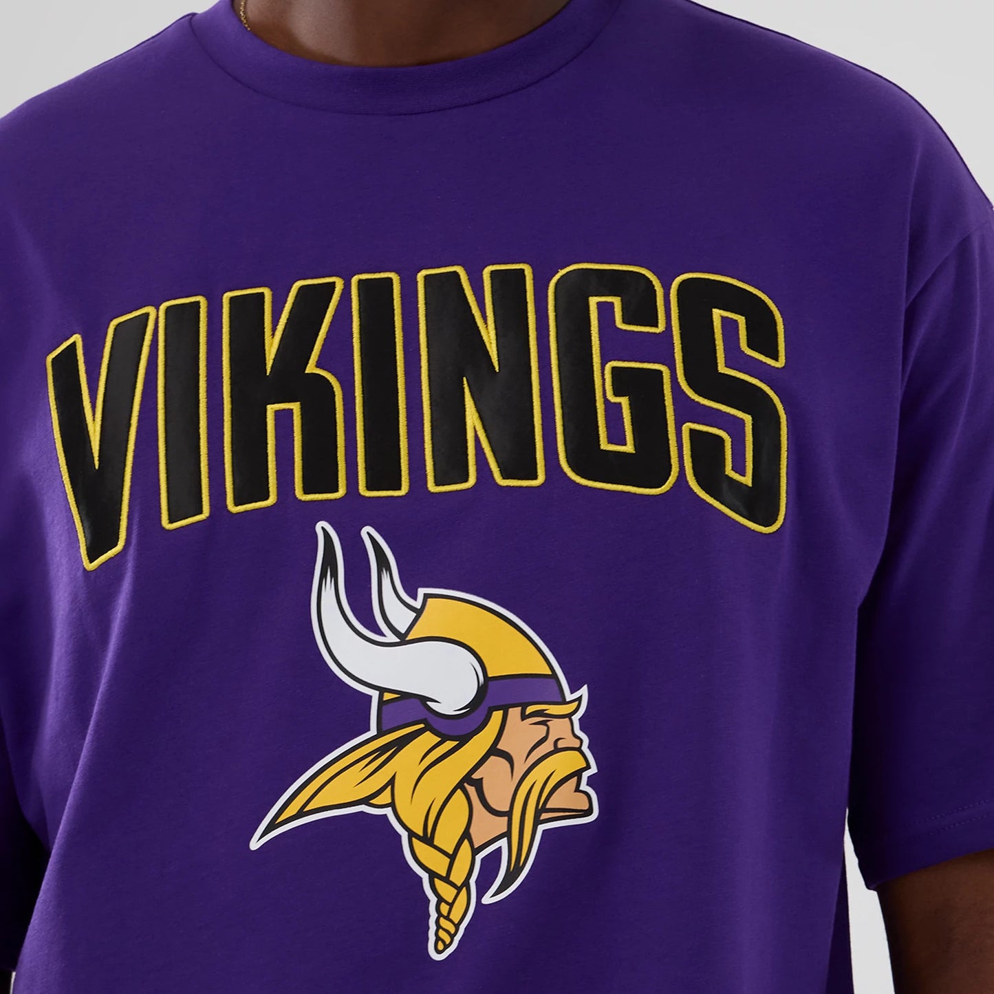 The Male model is wearing Minnesota Vikings NFL International Series Games 2025 Purple Premium T-Shirt 3