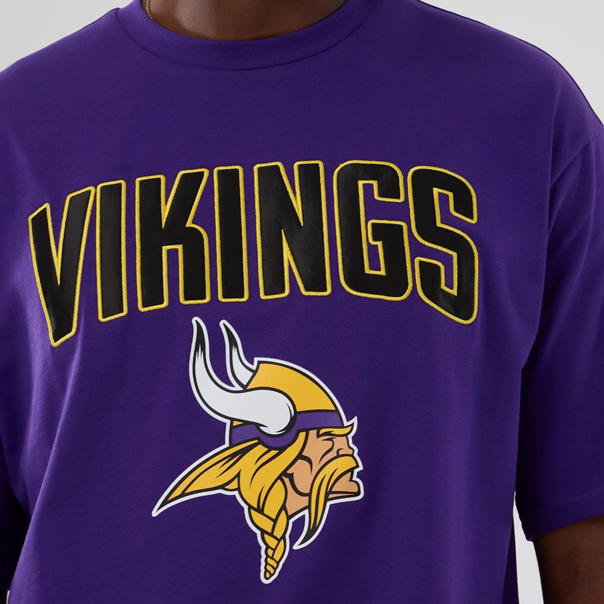 The Male model is wearing Minnesota Vikings NFL International Series Games 2025 Purple Premium T-Shirt  3